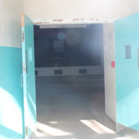 View of the Benet Auditorium Stage Through Front Door
